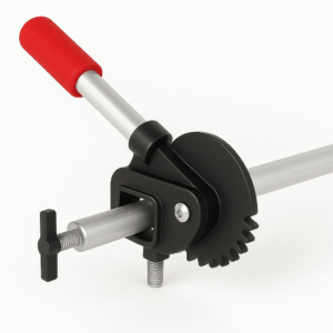 Close-up of a metal clamp tool with a red handle and black gear mechanism, designed for holding objects securely in place.